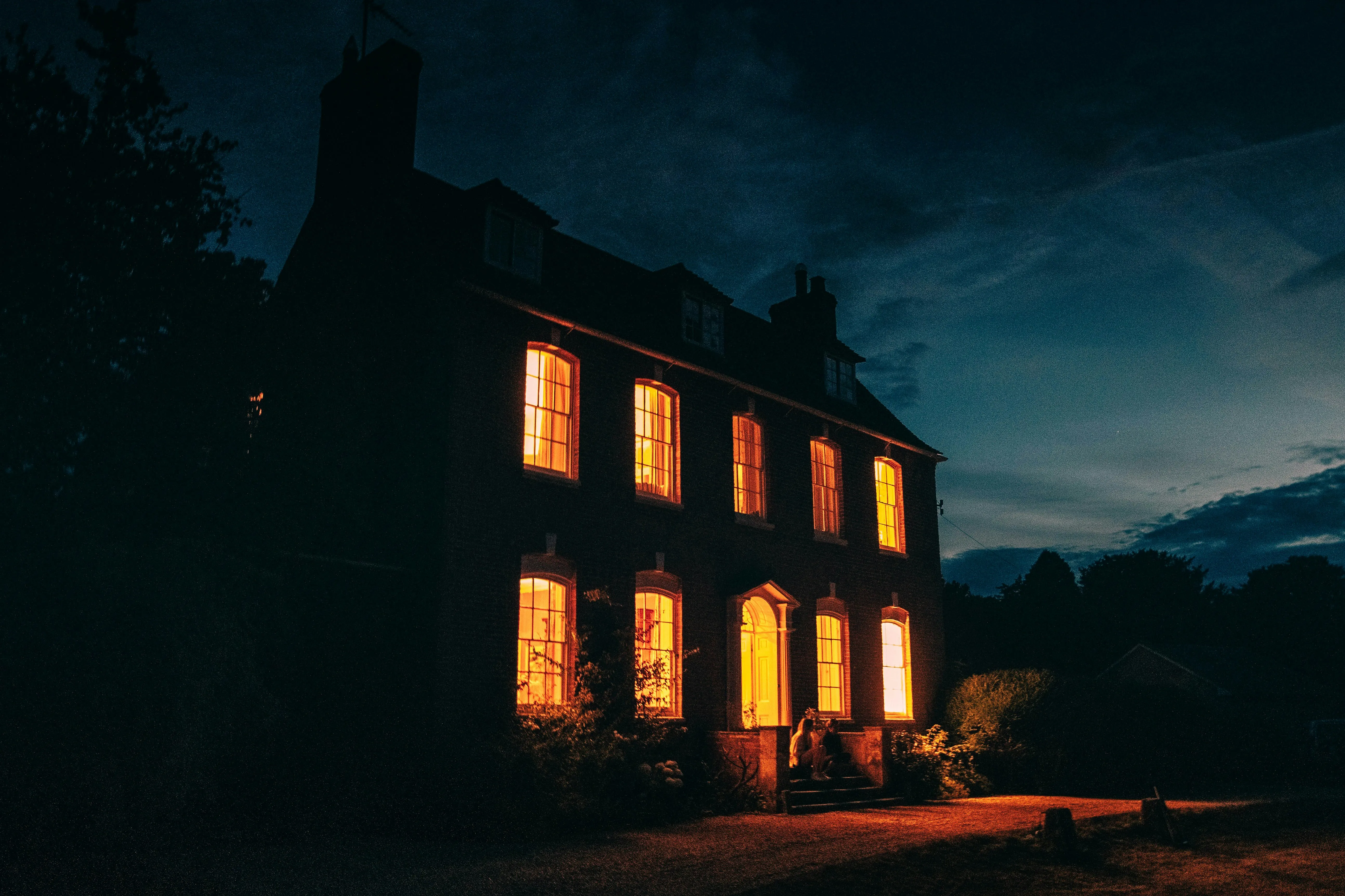 a house with bright lights at night